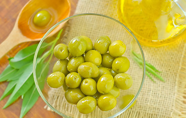 Image showing green olives and oil