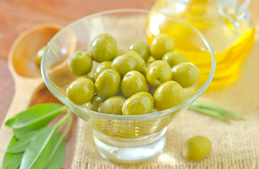 Image showing green olives and oil