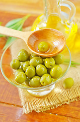 Image showing green olives and oil