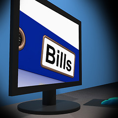 Image showing Bills On Monitor Showing Paying Expenses