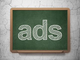 Image showing Advertising concept: Ads on chalkboard background