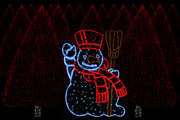 Image showing Illuminated Snowman and christmas trees 