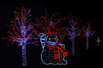 Image showing Illuminated Snowman and trees 