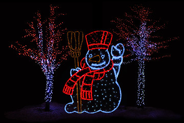 Image showing Illuminated Snowman and trees 