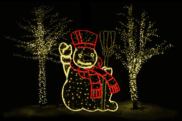 Image showing Illuminated Snowman and trees 