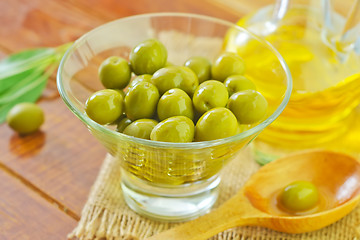 Image showing green olives and oil