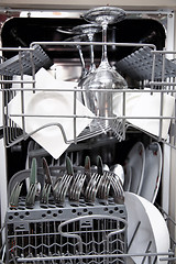 Image showing Open dishwasher with clean utensils