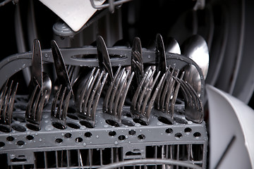 Image showing utensils with drops in during washing