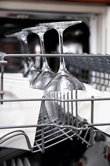 Image showing Open dishwasher with clean utensils