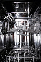 Image showing View of the interior of an empty opened dishwasher