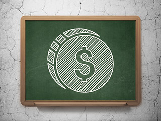 Image showing Money concept: Dollar Coin on chalkboard background