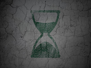 Image showing Timeline concept: Hourglass on grunge wall background