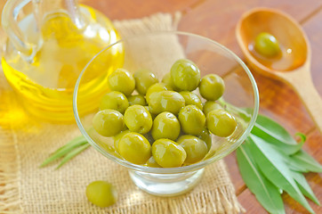 Image showing green olives and oil