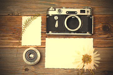 Image showing vintage camera, old lens and pressed flower