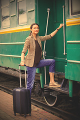Image showing woman at the door of an old railcar