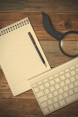 Image showing notebook, pen, magnifying glass and computer keyboard