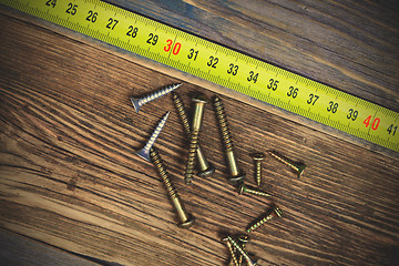 Image showing screws and measuring tape