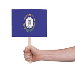 Image showing Hand holding small card - Flag of Kentucky