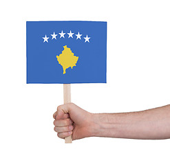 Image showing Hand holding small card - Flag of Kosovo