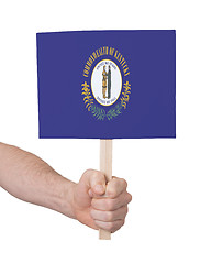 Image showing Hand holding small card - Flag of Kentucky