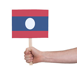 Image showing Hand holding small card - Flag of Laos