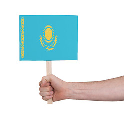 Image showing Hand holding small card - Flag of Kazakhstan