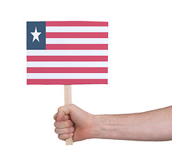 Image showing Hand holding small card - Flag of Liberia