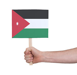 Image showing Hand holding small card - Flag of Jordan