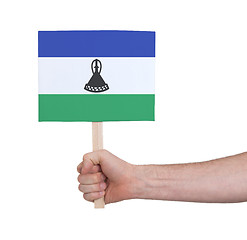 Image showing Hand holding small card - Flag of Lesotho