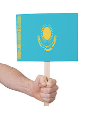 Image showing Hand holding small card - Flag of Kazakhstan