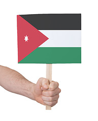 Image showing Hand holding small card - Flag of Jordan