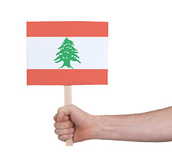 Image showing Hand holding small card - Flag of Lebanon