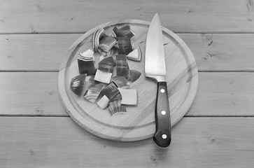 Image showing Chopped red onion with a knife on a chopping board
