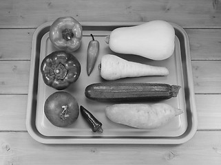 Image showing Selection of vegetables on a baking tray ready for roasting
