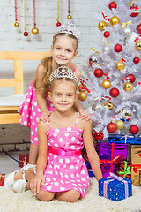 Image showing Two girls at the beauty of Christmas trees