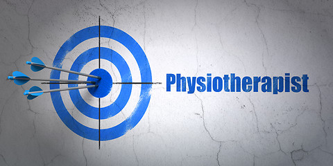 Image showing Health concept: target and Physiotherapist on wall background