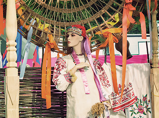 Image showing The ancient national dress and a hat on the dummy.