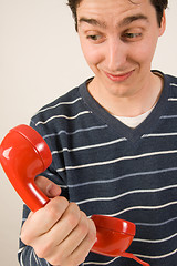 Image showing red telephone receiver