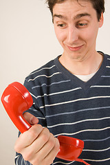 Image showing red telephone receiver