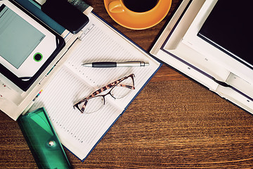 Image showing Book, notebook, glasses on your desktop.