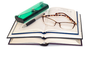 Image showing Glasses, books and notebooks on white background.
