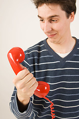 Image showing red telephone receiver