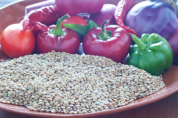 Image showing Lentils ready to be cooked with tomatoes , peppers , eggplant