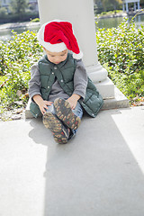 Image showing Melancholy Mixed Race Boy Wearing Christmas Santa Hat