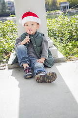 Image showing Cute Mixed Race Boy With Santa Hat and Candy Cane