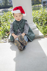 Image showing Melancholy Mixed Race Boy Wearing Christmas Santa Hat