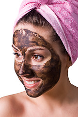 Image showing Beautiful girl with mud mask on face