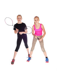 Image showing Two girls with tennis racquet.