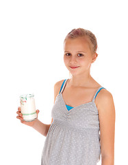 Image showing Girl holding a glass of milk.