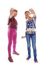Image showing Two girls holding there hands up.